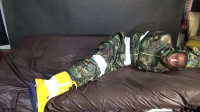 Watching Sexy Pia Being Tied And Gagged With Tape On A Bed Wearing A Sexy Camouflage Shiny Nylon Rainpants And A Rainjacket As Well As Yellow Rubber Boots (Video) - hotmovs.com