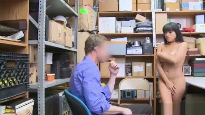Young Asian woman in off-shoulder top meets man in blue shirt in cluttered storage room - yesvids.com